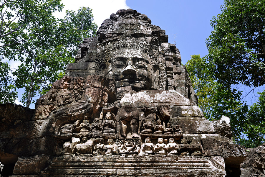 pediment with damaged Lokeshvara figure at Ta Som's western face tower 