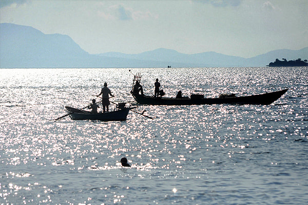 fisherman on boats near Kep