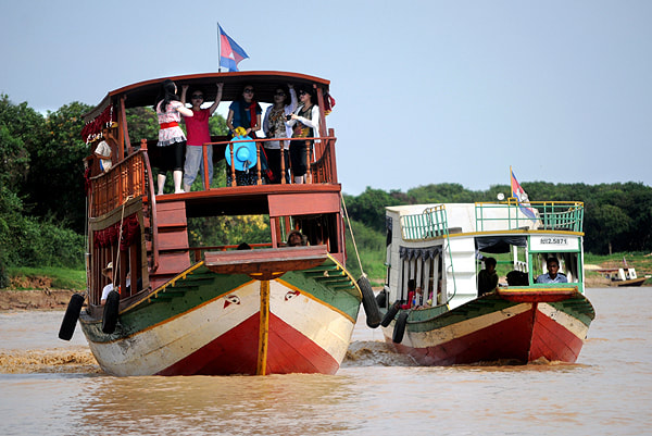 boats on Siem Reap river issuing into Tonle Sap 