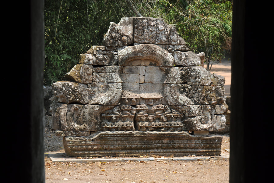 pediment relief depicting worshippers, reerected on the ground