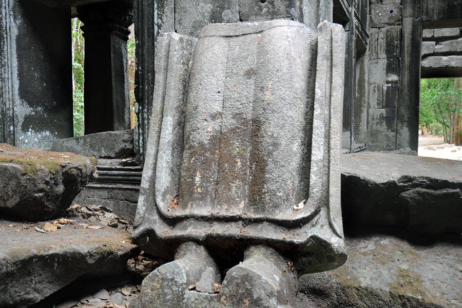 broken sculpture in the southern satellite temple of Preah Khan
